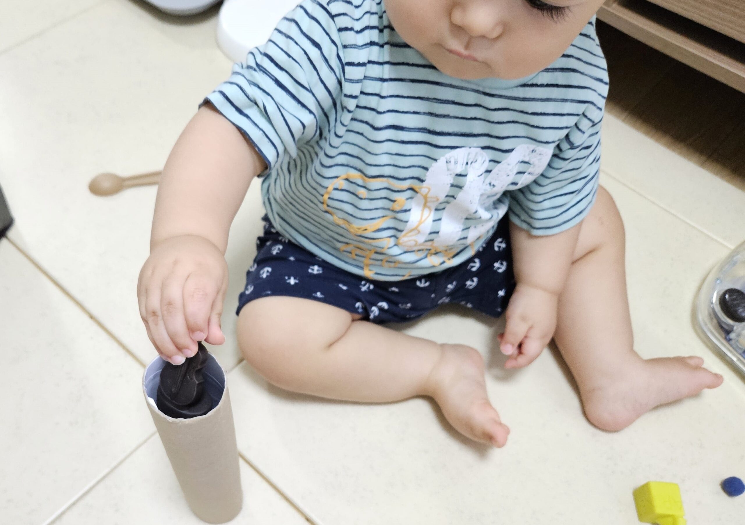 Toddler Playing with Pom-poms, pom-pom activities for toddlers