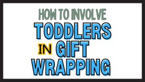 Toddler helps gift wrapping