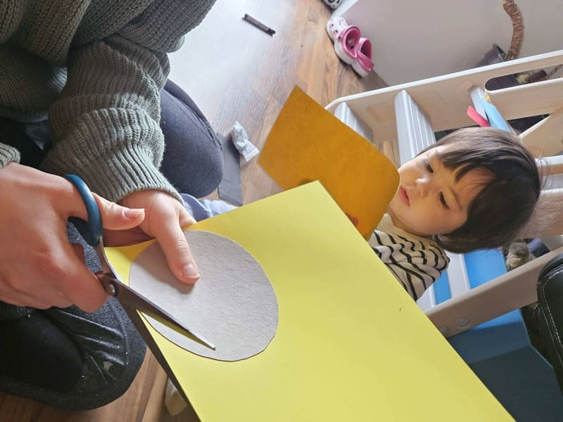 Sun Craft For Toddlers - Cutting Out the Yellow Craft Paper sun